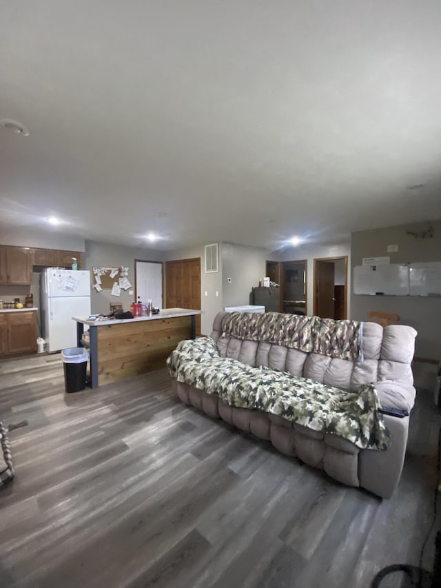 living room with dark hardwood / wood-style flooring