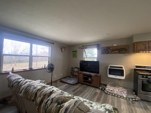 living room featuring light wood-type flooring and heating unit