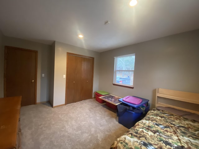 carpeted bedroom with a closet