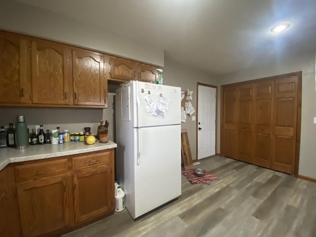 kitchen featuring light hardwood / wood-style floors and white refrigerator