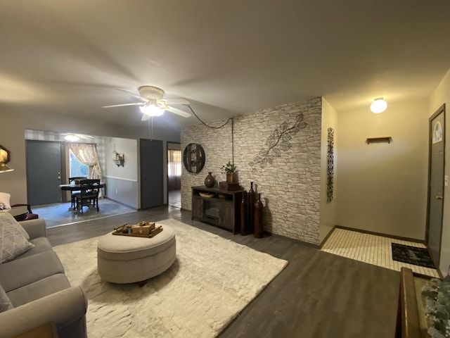 living room with hardwood / wood-style flooring and ceiling fan