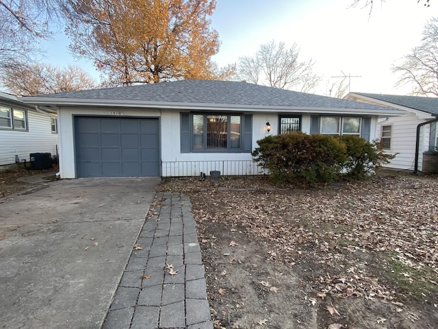 single story home featuring a garage