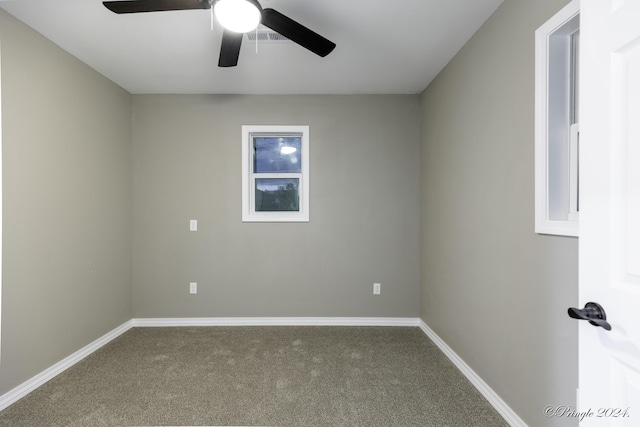 carpeted empty room featuring ceiling fan