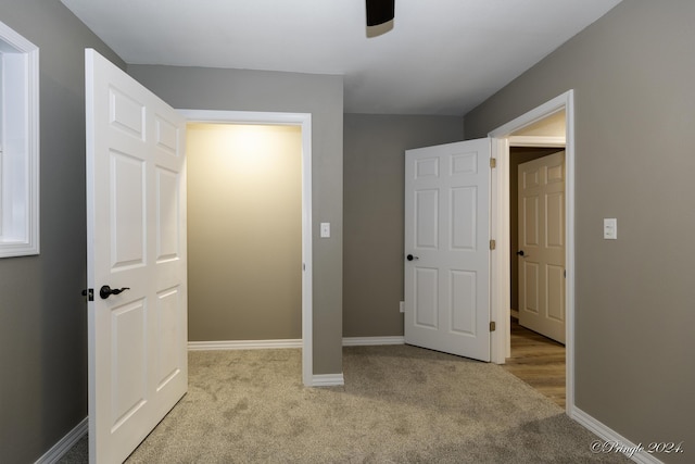 unfurnished bedroom featuring light colored carpet