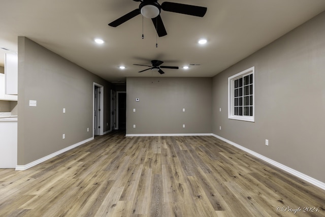 unfurnished living room featuring light hardwood / wood-style floors and ceiling fan