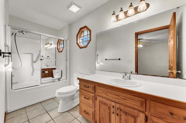 full bathroom featuring vanity, bath / shower combo with glass door, tile patterned flooring, ceiling fan, and toilet