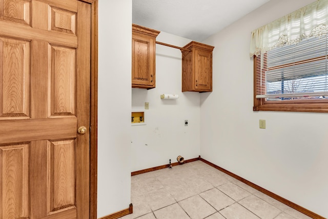 clothes washing area with electric dryer hookup, cabinets, gas dryer hookup, hookup for a washing machine, and light tile patterned flooring