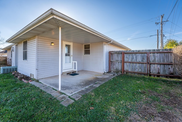 rear view of property with a yard