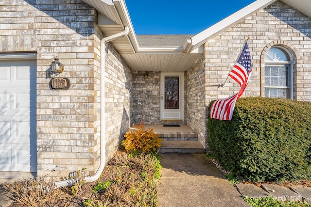 property entrance with a garage