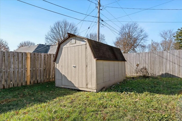 view of outbuilding with a lawn