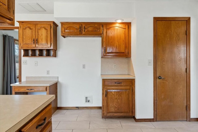 kitchen with light tile patterned flooring