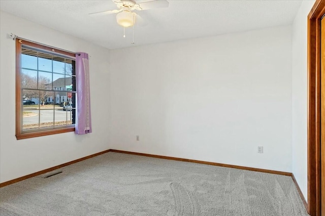 carpeted empty room with ceiling fan