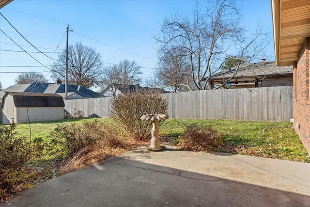 exterior space featuring a patio and a shed