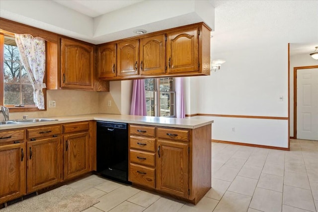 kitchen with dishwasher, light tile patterned floors, kitchen peninsula, and sink