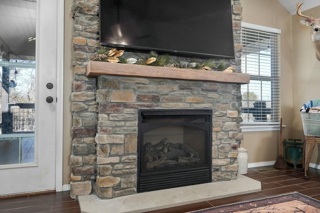 details with a fireplace and hardwood / wood-style flooring