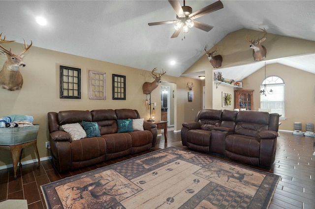 living room featuring dark hardwood / wood-style floors, vaulted ceiling, and ceiling fan