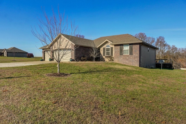 ranch-style house with a garage and a front lawn