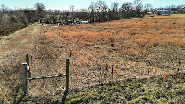 birds eye view of property with a rural view