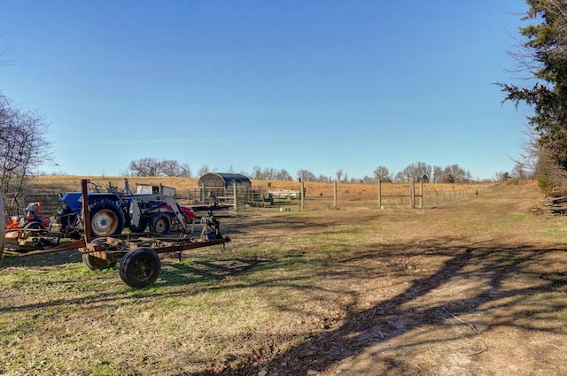 view of yard with a rural view