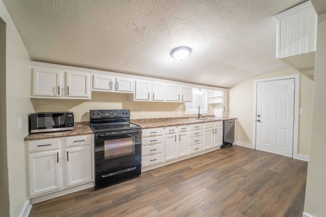 kitchen featuring white cabinets, stainless steel appliances, dark wood-type flooring, and sink