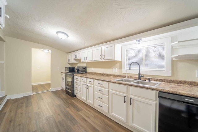 kitchen featuring dark hardwood / wood-style flooring, sink, white cabinets, and black appliances