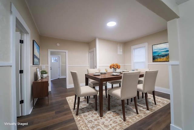 dining space featuring dark hardwood / wood-style flooring