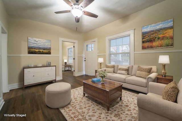 living room featuring dark hardwood / wood-style floors and ceiling fan