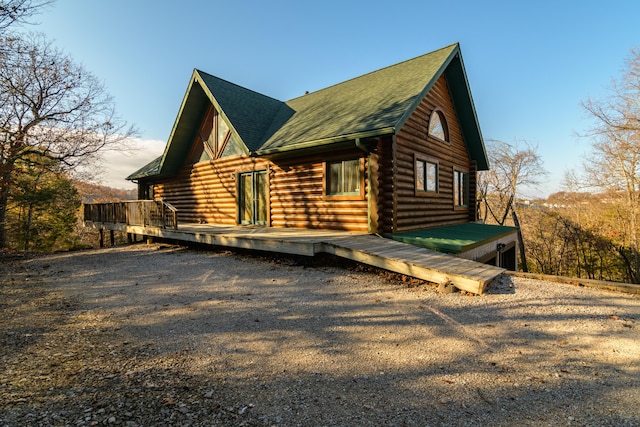 view of side of home with a deck