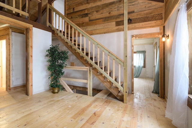 stairway with hardwood / wood-style floors