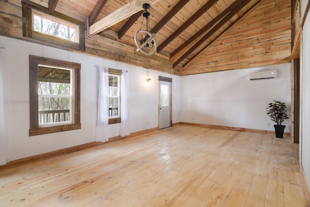 spare room featuring light hardwood / wood-style floors, an AC wall unit, high vaulted ceiling, and wooden ceiling