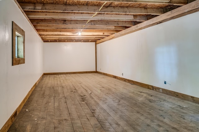 basement with wood-type flooring