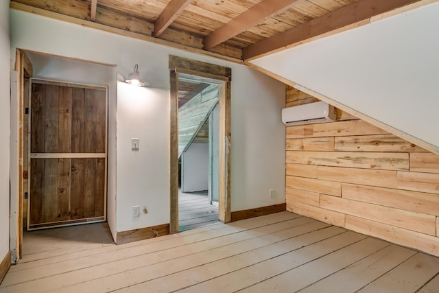 bonus room featuring hardwood / wood-style floors, a wall mounted AC, wooden ceiling, and beam ceiling