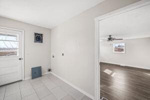 laundry room with hardwood / wood-style floors, ceiling fan, and electric dryer hookup