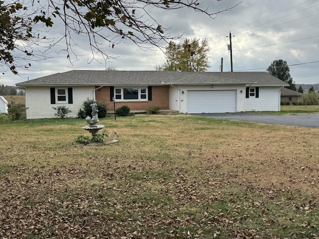 ranch-style house with a front lawn and a garage