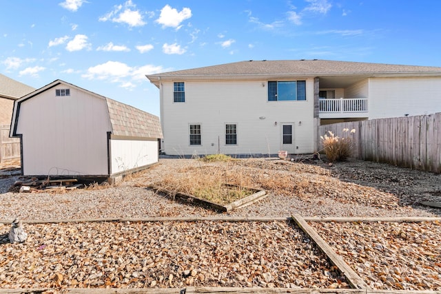 rear view of house with a shed