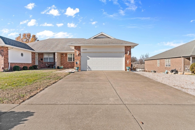 single story home featuring a front yard and a garage