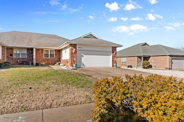 ranch-style home featuring a front lawn and a garage