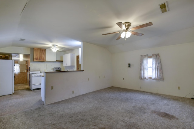 unfurnished living room with ceiling fan, light colored carpet, and lofted ceiling