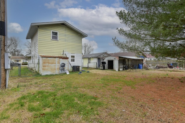 back of property featuring a yard and cooling unit