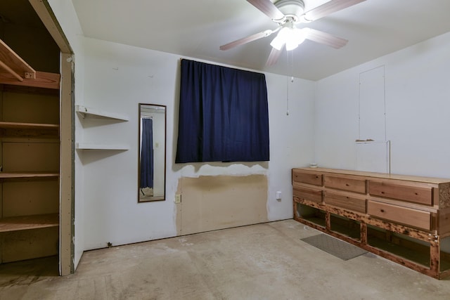 unfurnished bedroom featuring ceiling fan and concrete floors