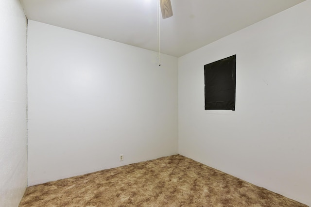 unfurnished room featuring ceiling fan and carpet floors