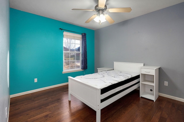 bedroom featuring ceiling fan and dark hardwood / wood-style flooring