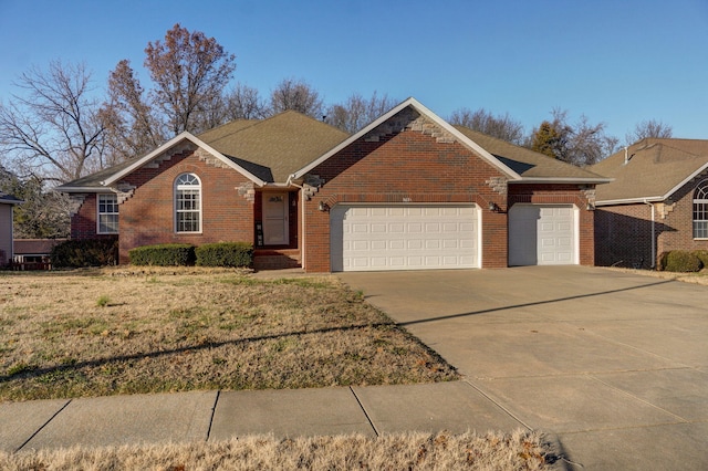 ranch-style house featuring a garage