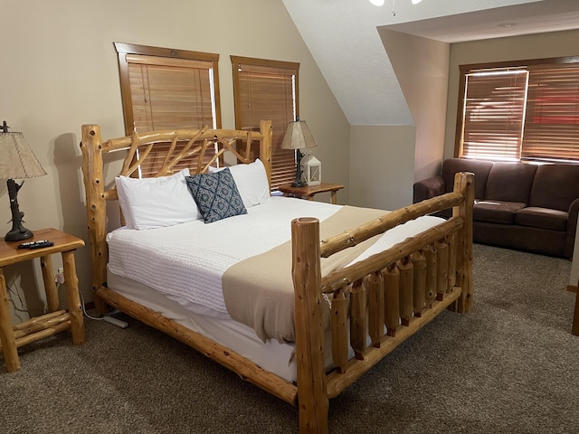 carpeted bedroom featuring vaulted ceiling