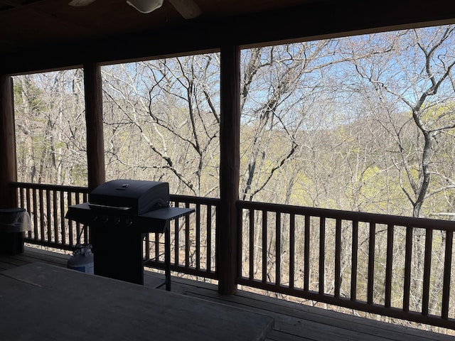 deck featuring ceiling fan and grilling area