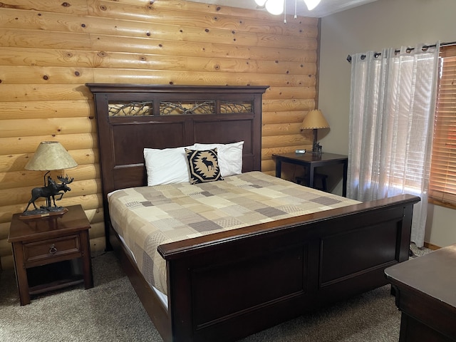 carpeted bedroom with log walls