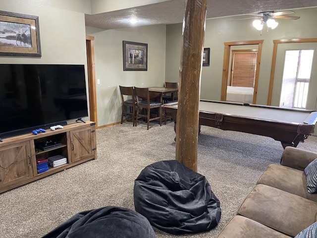 game room featuring pool table, a textured ceiling, and light carpet