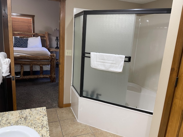 bathroom with tile patterned floors and combined bath / shower with glass door