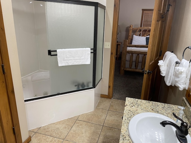 bathroom with vanity, tile patterned floors, and enclosed tub / shower combo