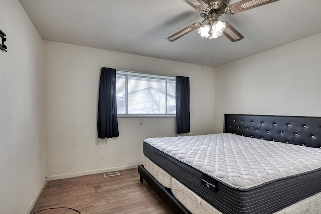 bedroom featuring hardwood / wood-style floors and ceiling fan